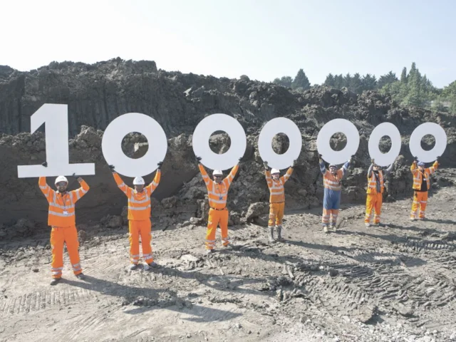 Crossrail workers celebrate shifting the one millionth tonne of excavated earth via rail. Photo: Crossrail. Crossrail workers celebrate shifting the one millionth tonne of excavated earth via rail. Photo: Crossrail.