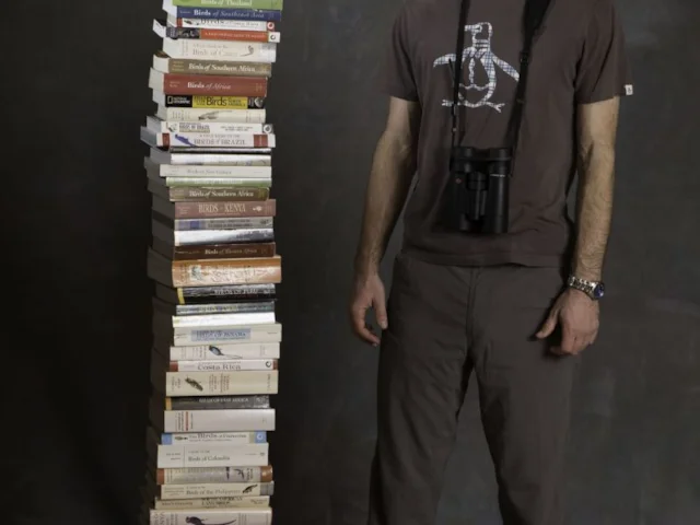 Noah Strycker made full use of his stack of field guides during his year-long trip, along with many local nature and birding guides. Photo: Bob Keefer. Noah Strycker made full use of his stack of field guides during his year-long trip, along with many local nature and birding guides. Photo: Bob Keefer.