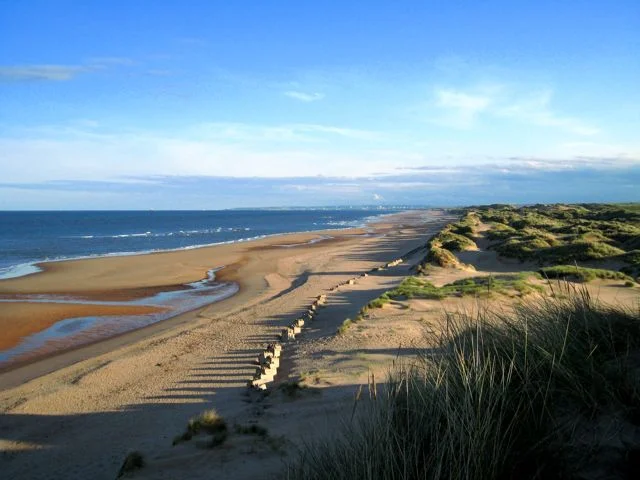 The view along the beach towards Aberdeen from Trump's golf links, showing part of the environmentally-sensitive dune system already encroached upon by his first scheme. Photo: Martyn Gorman (commons.wikimedia.org). The view along the beach towards Aberdeen from Trump's golf links, showing part of the environmentally-sensitive dune system already encroached upon by his first scheme. Photo: Martyn Gorman (commons.wikimedia.org).