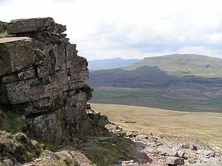 Northwest from Fountains Fell; Pen-y-Ghent is to the right in the middle distance and Ingleborough is in the far distance. Northwest from Fountains Fell; Pen-y-Ghent is to the right in the middle distance and Ingleborough is in the far distance.
