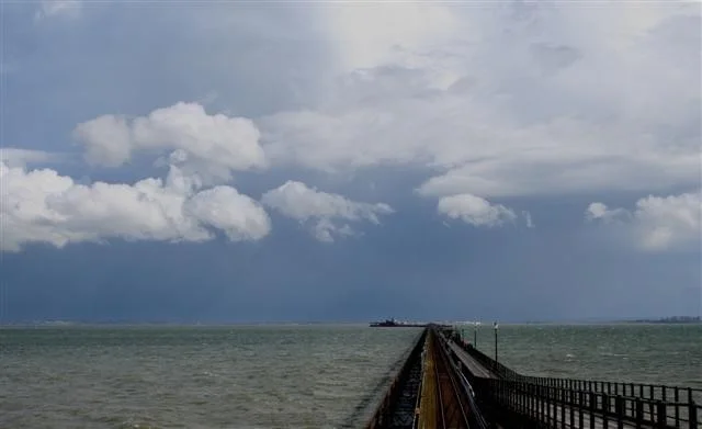 The pier with a storm brewing over Kent. The pier with a storm brewing over Kent.