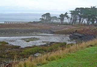 Image taken looking north towards the old Yelland Power Station site and jetty adjacent to the River Taw, from the old hot water outfall embankment. Taken using Sony DSCP10 camera. Image taken looking north towards the old Yelland Power Station site and jetty adjacent to the River Taw, from the old hot water outfall embankment. Taken using Sony DSCP10 camera.
