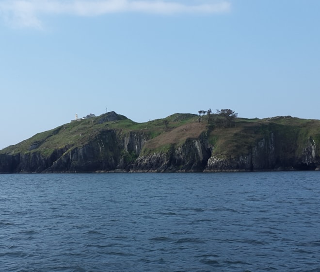 Lighthouse at north-east point of island from Baltimore Harbour. Lighthouse at north-east point of island from Baltimore Harbour.