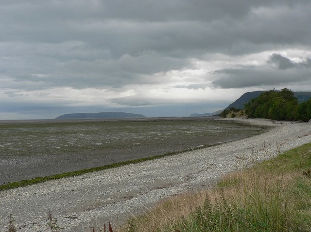 At low tide showing Puffin Island and Great Orme Head in the distance At low tide showing Puffin Island and Great Orme Head in the distance